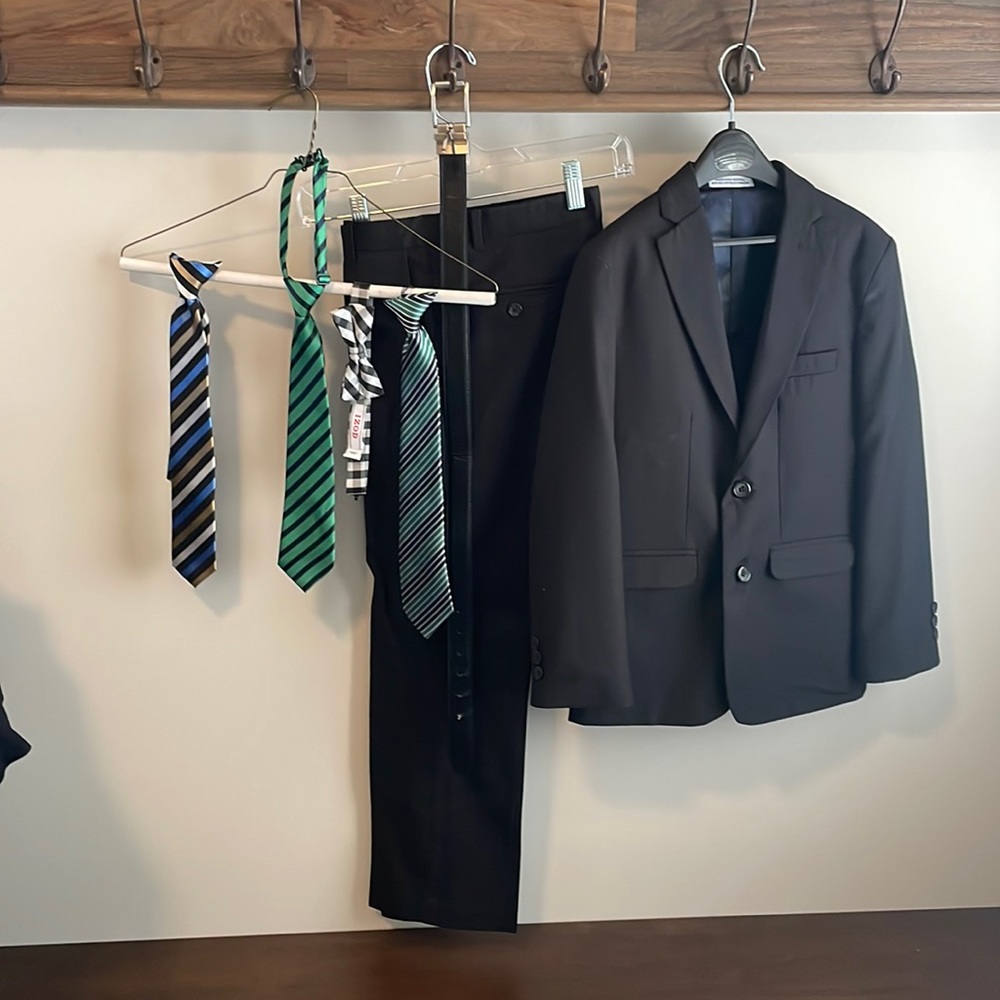 Black Izod boys 2 pc suit with variety of ties and belt